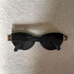Authentic Givenchy women sunglasses. With cace.Black.condition good Regular wear